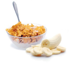 Cornflakes mit Milch und Bananenrädli oder geraffeltem Apfel